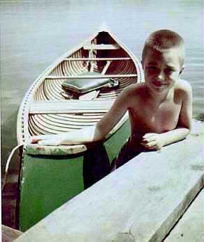 The editor with the suthor's canoe, 1954 (13 kB JPEG)